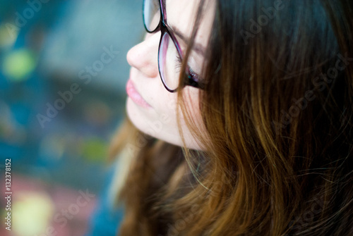 Beautiful girl with glasses. Woman with blue eyes with glasses.