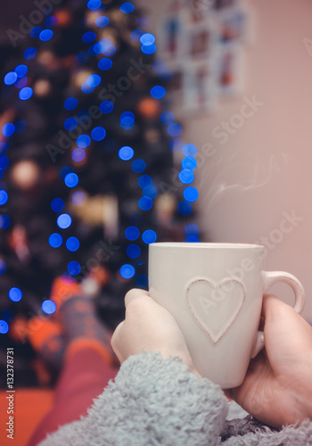 woman hands holding a cup of coffee or tea