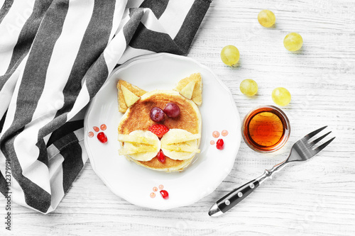 Fototapeta Naklejka Na Ścianę i Meble -  Plate with creative homemade pancake on wooden table