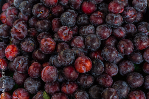 ripe purple plums background - healthy country food
