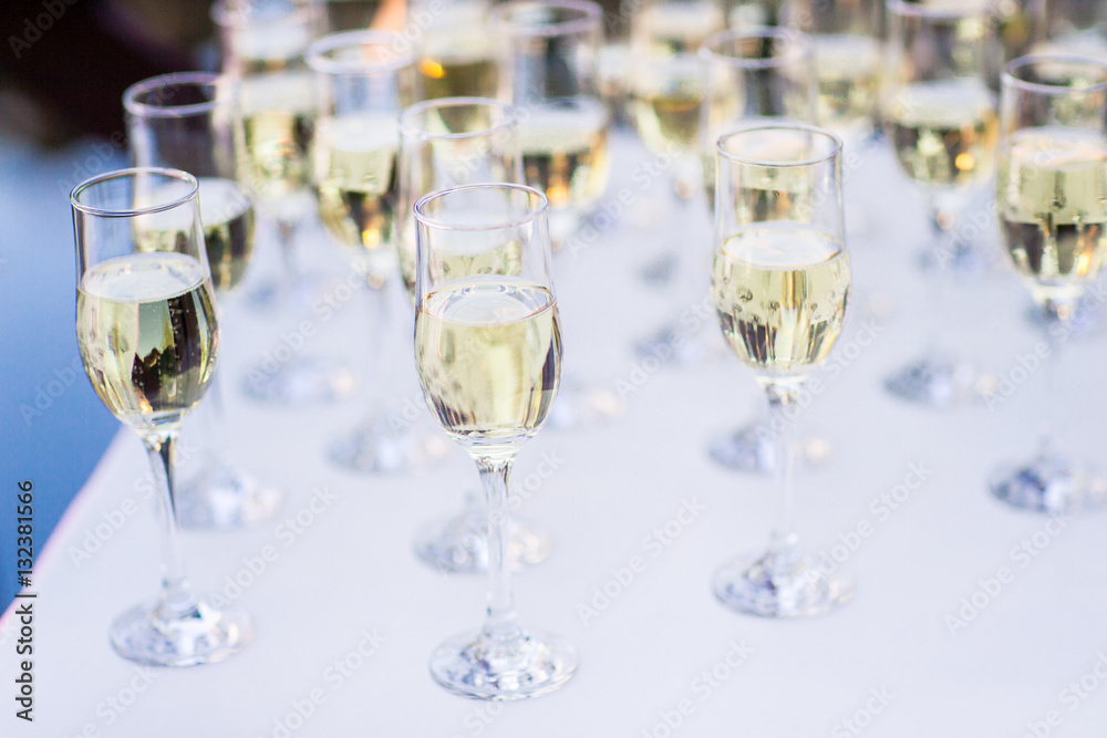row of champagne glasses row of champagne glasses