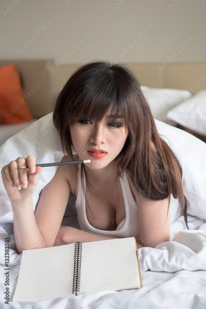 blurred motion young sexy asian woman on white bed, Pretty lady enjoying spare time in her bed. blurred motion young sexy asian woman on white bed, Pretty lady enjoying spare time in her bed.