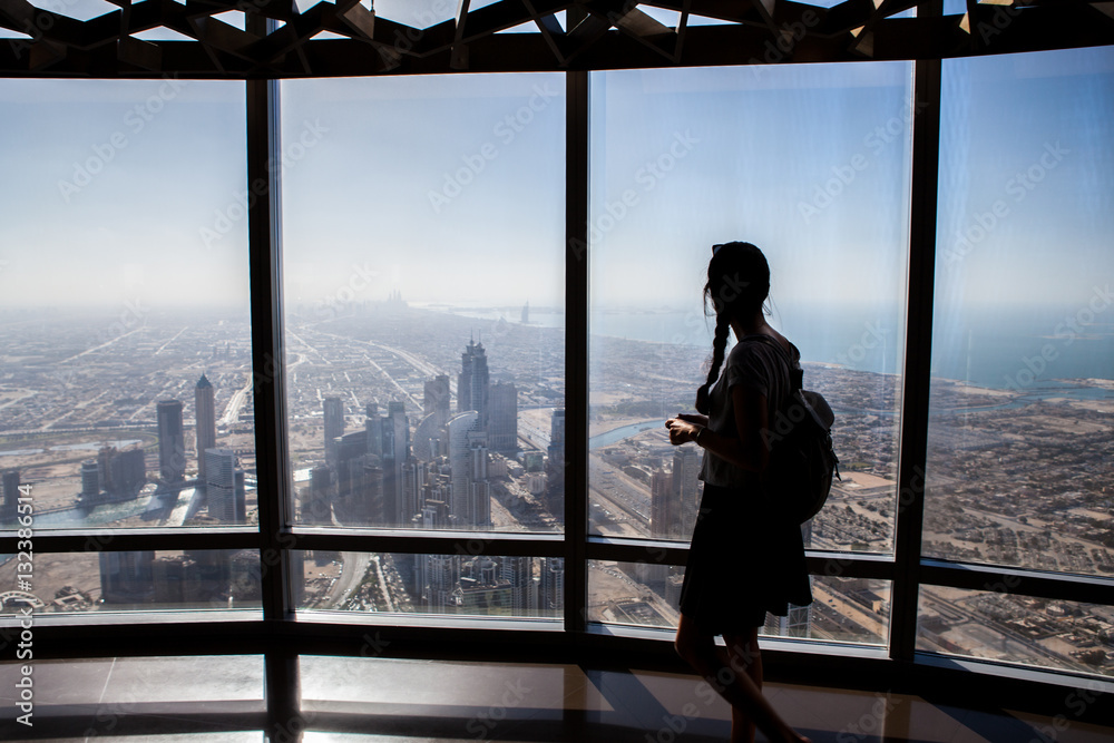 Girl Silhouette Taking Photos From Above In a Skyscraper. Sihlouete in a office building