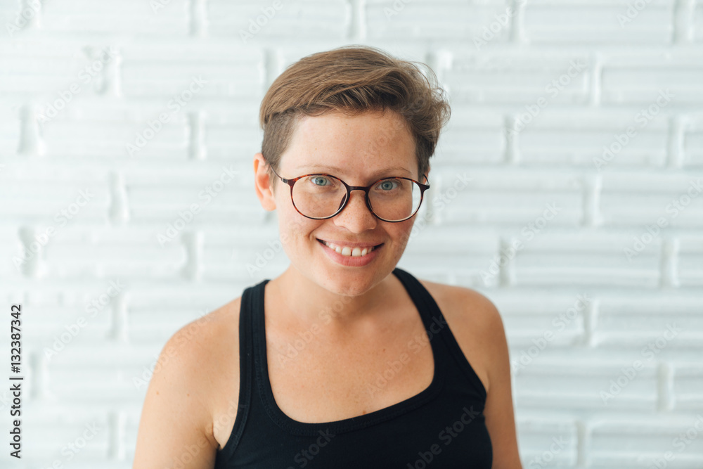 natural beauty. portrait of a young beautiful attractive girl. Short hair,  no makeup, wearing glasses to view hipster style Stock Photo