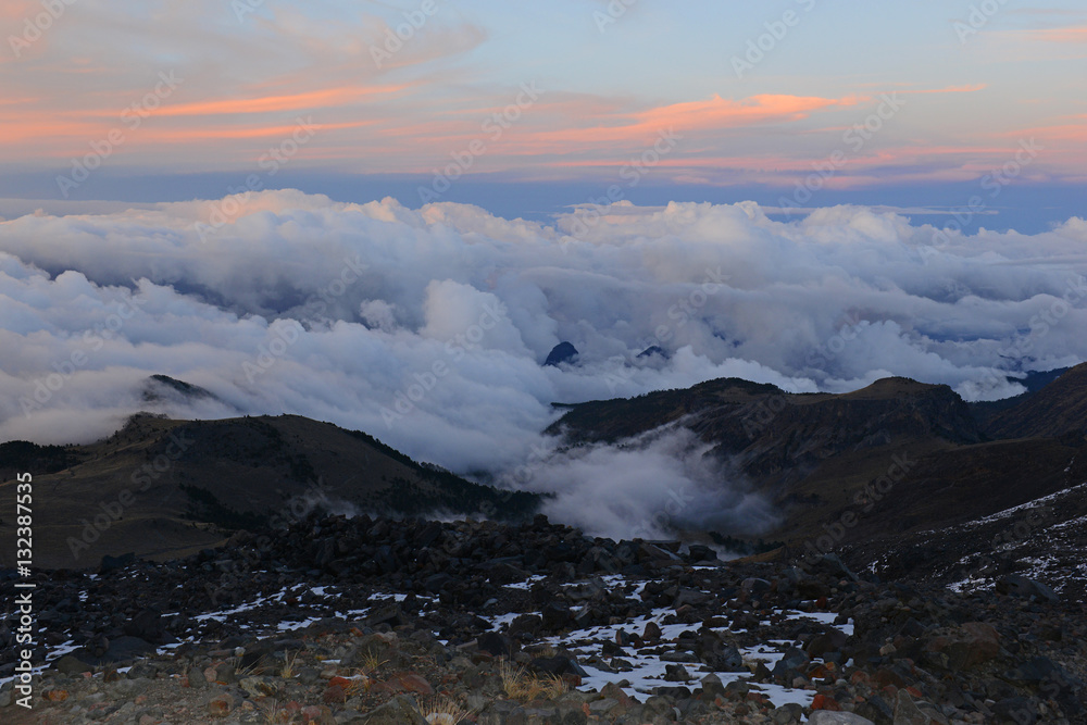 Alpine terrain with rock, snow and ice on Pico de Orizaba volcano, or Citlaltepetl, the highest mountain in Mexico, taken on a climb of the mountain