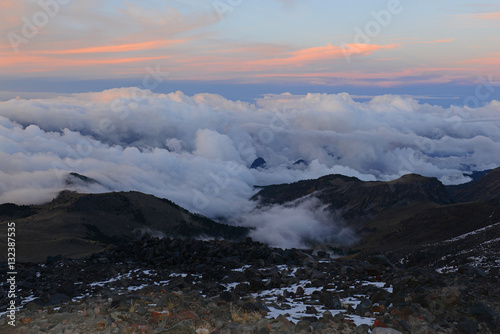 Alpine terrain with rock, snow and ice on Pico de Orizaba volcano, or Citlaltepetl, the highest mountain in Mexico, taken on a climb of the mountain