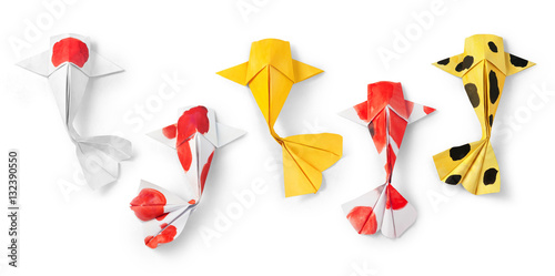 handmade paper craft origami koi carp fish on white background. photo