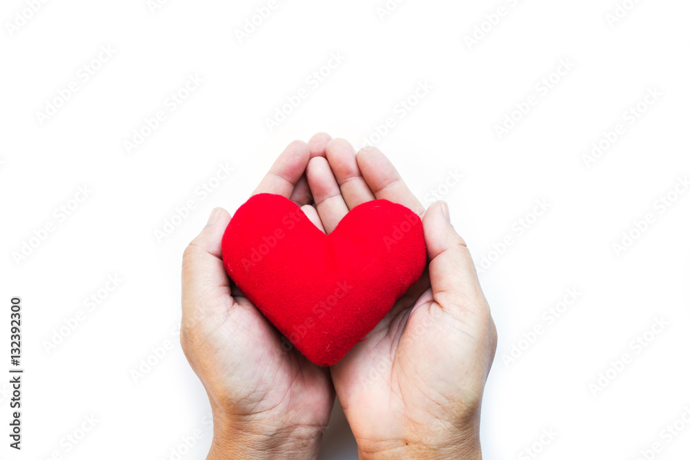 red pillow heart in two palms hand, for Valentine day, happy New Year celebration, the meaning of love, warm feeling by sending the messages to someone the best wishes, and love, on white background