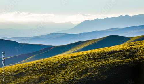 The sunset layers of mountains, vast background material.