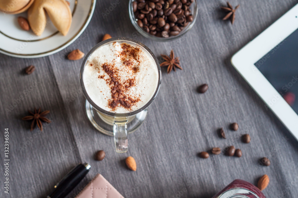 Morning latte with fortune cookies on a gray tablecloth Morning latte with fortune cookies on a gray tablecloth