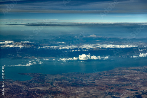 The mountains on the coast sea, view from the top. Photo from the plane. Turkey. 