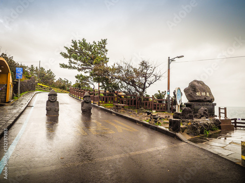 View of twin idols and stone sign nearby Yongduam that also know photo