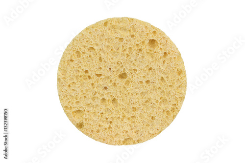 Beige round cosmetic sponge pad for face make-up cleaning, isolated on white background, clipping path included