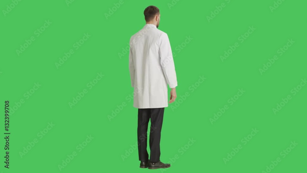 Long Shot of a Handsome Serious-Minded Scientist and Camera Rotating around Him. All Shot on a Green Screen Background.
