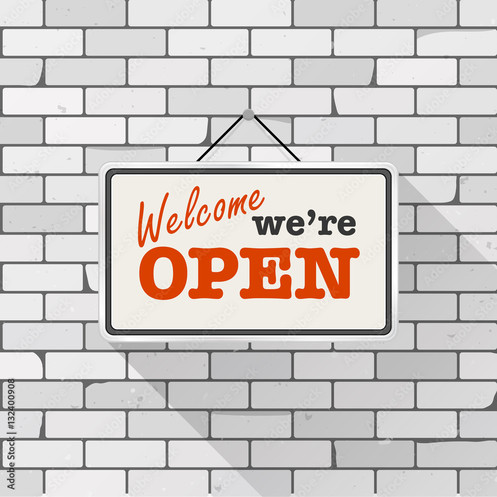 Simple white sign with text 'Come in we're open' hanging on a gray brick wall. Grunge brickwork background, textured rough surface. Creative business interior template for shop, store, supermarket. Simple white sign with text 'Come in we're open' hanging on a gray brick wall. Grunge brickwork background, textured rough surface. Creative business interior template for shop, store, supermarket.