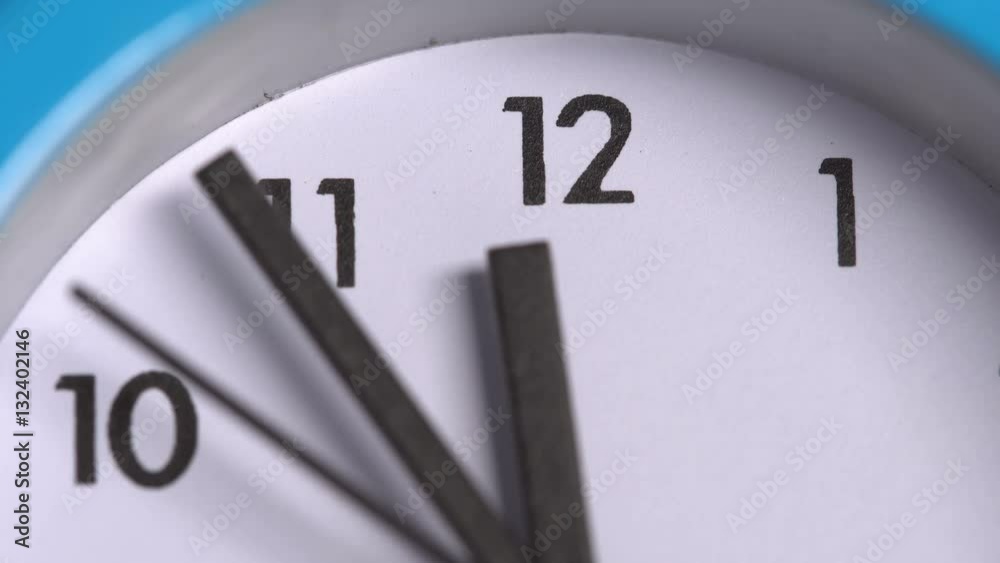 The arrows on the clock 23:55. Close-up The arrows on the clock 23:55. Close-up