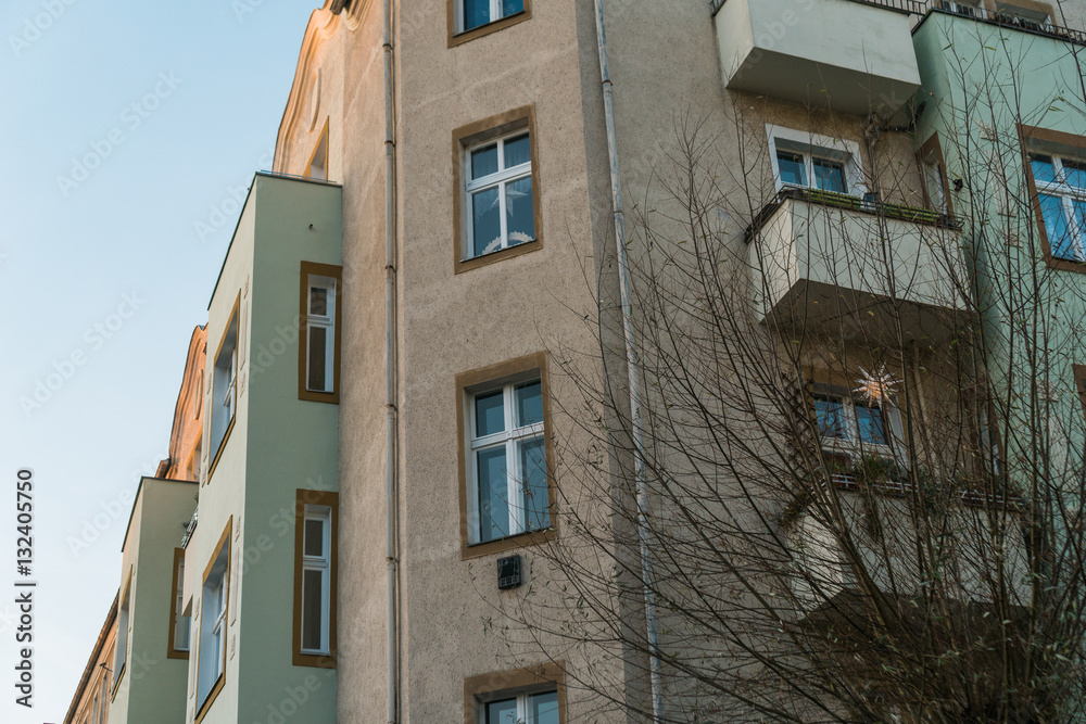 Naklejka premium grey and green facaded apartment corner house