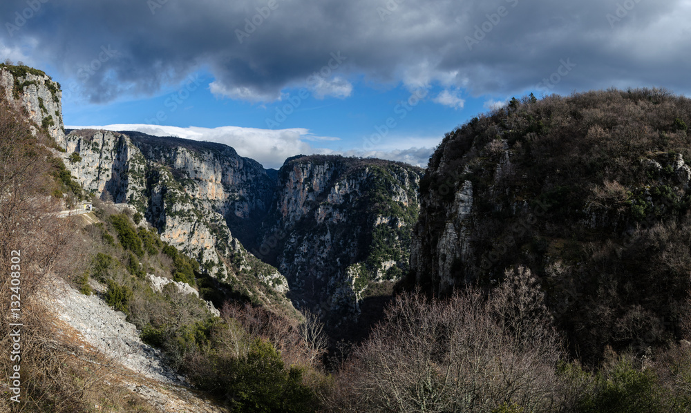 The impressive Vikos gorge in the Zagoria region, Western Greece, the deepest in Europe, with some ruins of a monk house.