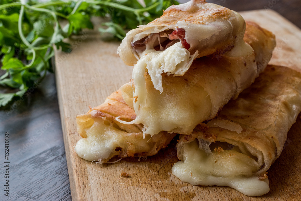 Turkish Pacanga Boregi with pastirma and cheddar (melted) cheese / pastirmali borek Turkish Pacanga Boregi with pastirma and cheddar (melted) cheese / pastirmali borek