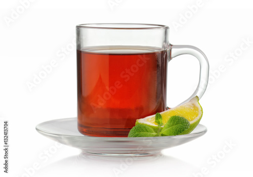 Tea cup with fresh mint and lime isolated