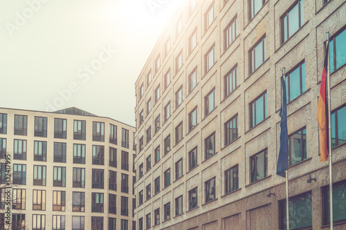 modern office buildings with european and german flag