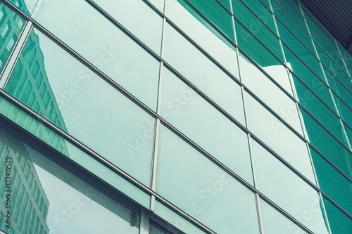 modern glass facade in blue and green colors