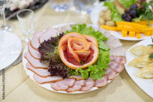 Dinning table set with baked sliced ham