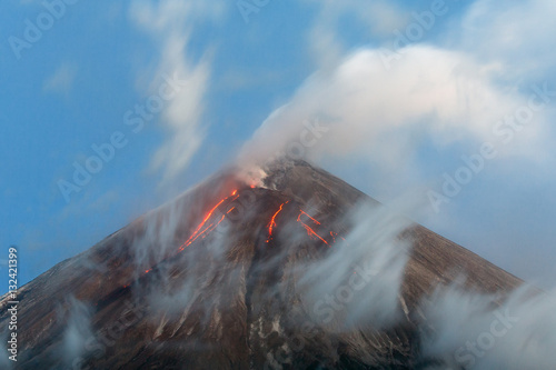 Принти на полотні Kamchatka volcanic landscape: active Klyuchevskoy Volcano, view of volcanic eruption - lava flows on slope of volcano; plume of gas, steam and ashes from crater