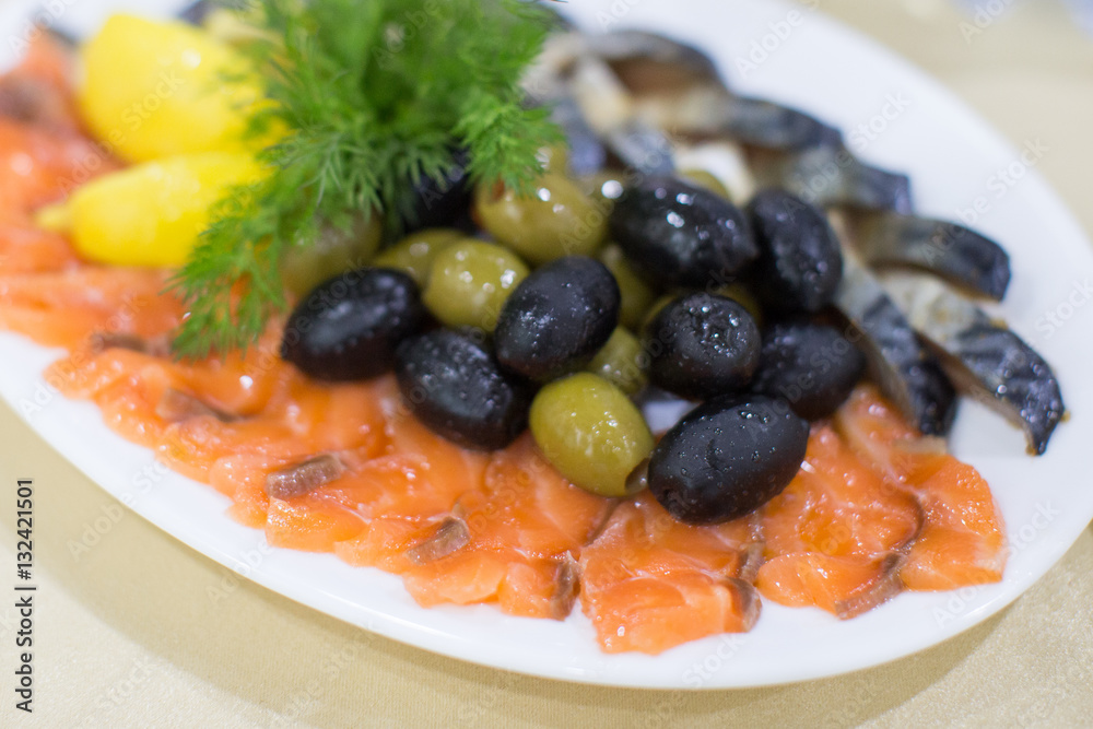 fresh roast wild pink salmon meat fillet with black olives and raw lemon fresh roast wild pink salmon meat fillet with black olives and raw lemon
