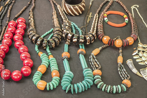 African traditional handmade bright jewelry colorful beads bracelets, necklaces. photo