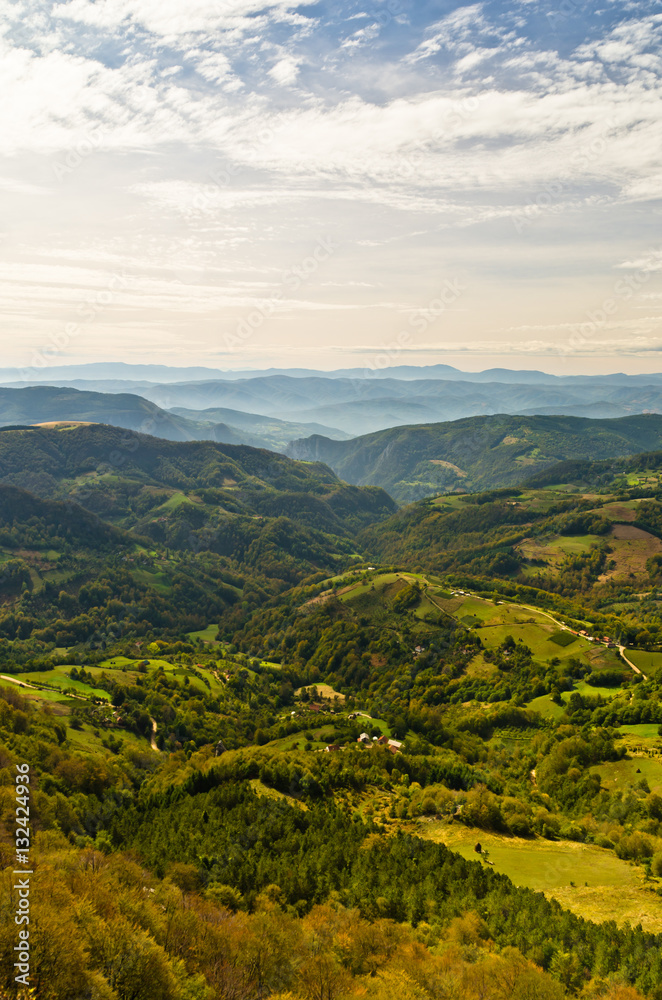 Viewpoint on a landscape of mount Bobija, peaks, hills, meadows and green forests, west Serbia