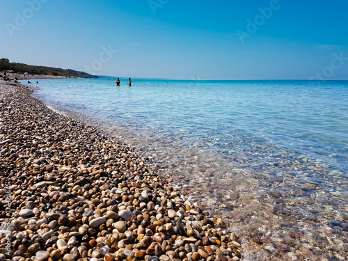 pebbly beach and crystal clear sea