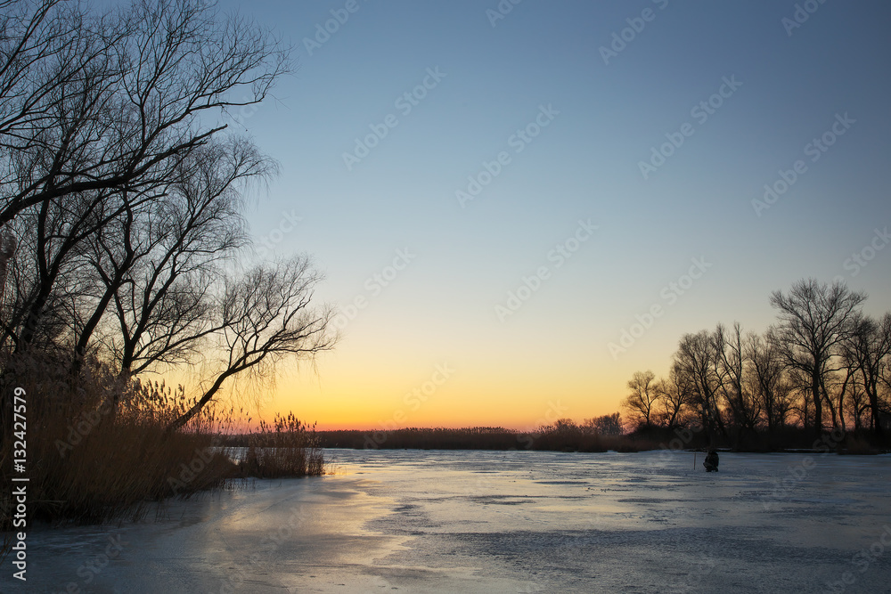 Winter landscape with sunset sky and frozen river. Winter landscape with sunset sky and frozen river.