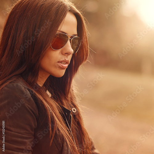 Beautiful female model wearing sunglasses