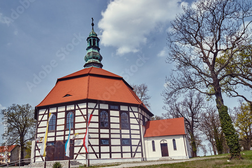 Tudor style country church with a bell tower in Poland.