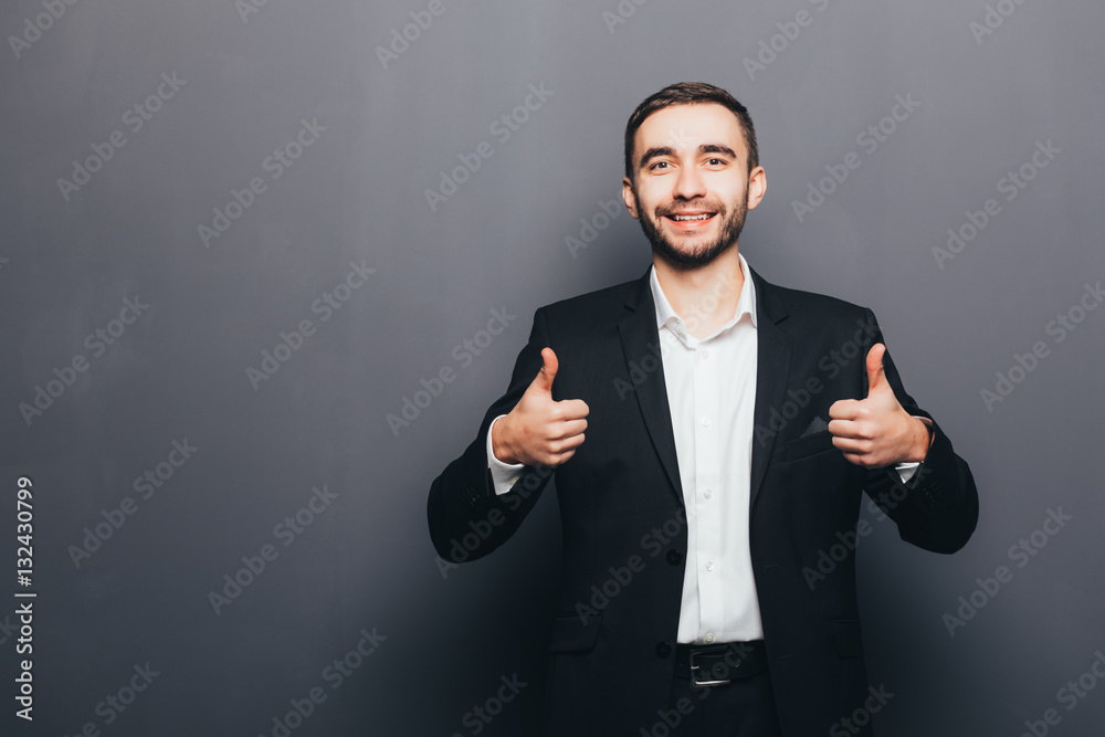 Young businessman in suit super gesture  isolated
