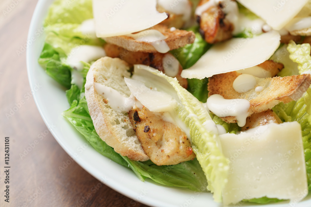 macro shot of fresh homemade caesar salad with chicken, shallow depth of field macro shot of fresh homemade caesar salad with chicken, shallow depth of field