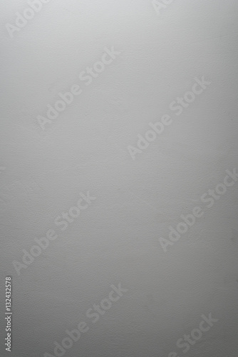 white even cement plaster wall with light gradient, background photo