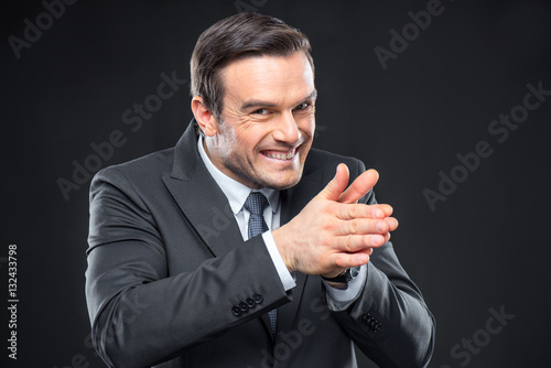Fotografija Scheming man rubbing his hands