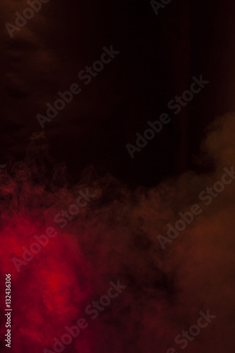 Red smoke in a dark room. Texture, background 