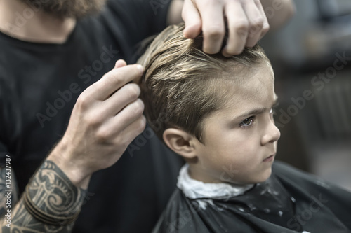 Kid's hair styling in barbershop