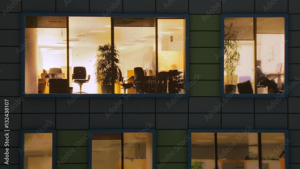 Windows light up in the house. Fragment of the layout of the building