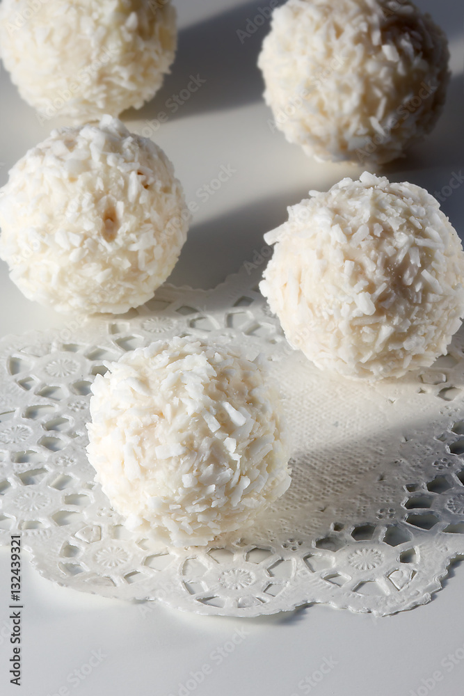 White chocolates with coconut and nuts inside White chocolates with coconut and nuts inside