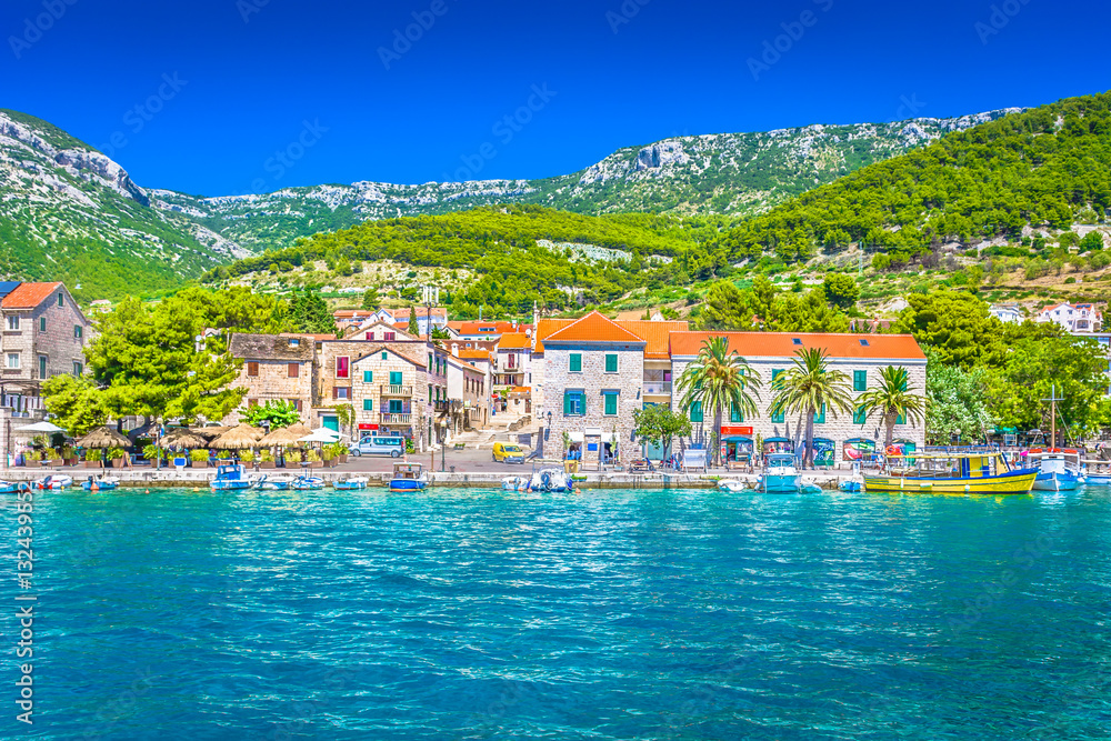 Town Bol waterfront view. / Scenic mediterranean coastal town Bol on Island Brac, Croatia summertime travel places.