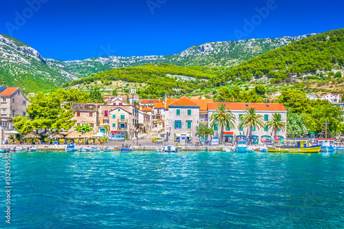 Town Bol waterfront view. / Scenic mediterranean coastal town Bol on Island Brac, Croatia summertime travel places. photo