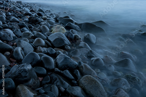 Wet stone on shore