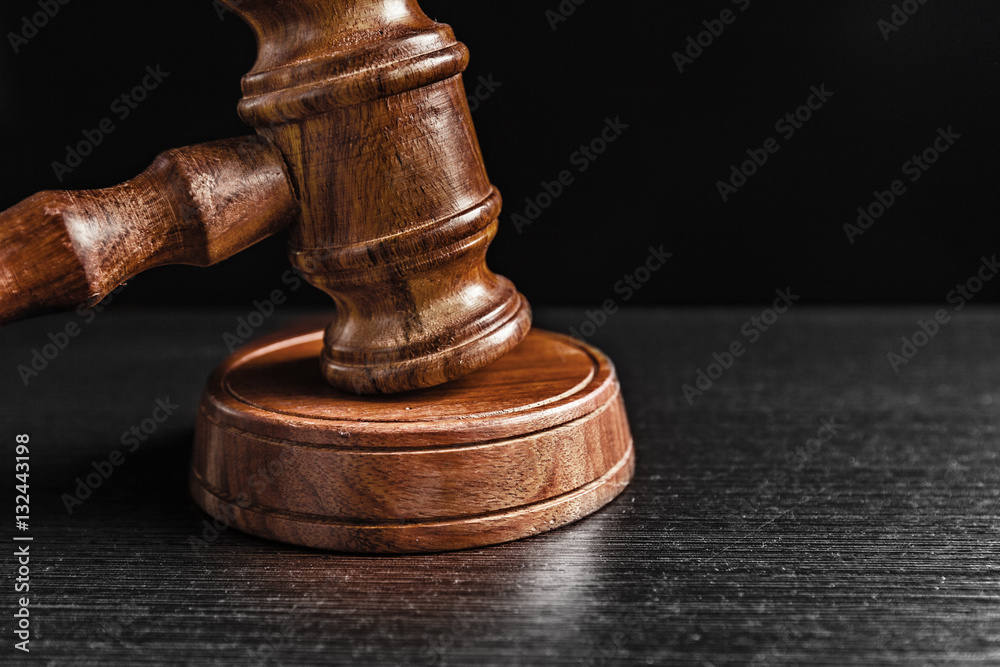 Judge's Gavel over black background Judge's Gavel over black background
