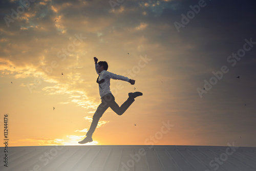 Silhouette of Business man Celebration Success Happiness Sunset Evening Sky Background
