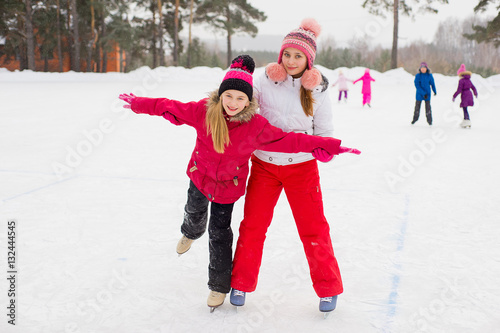 two attractive skater girls on the ice