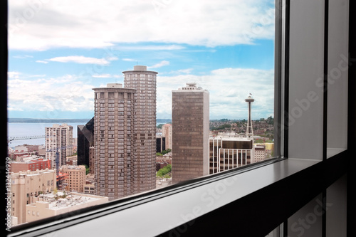 View of downtown Seattle and the Space Needle through a picture window